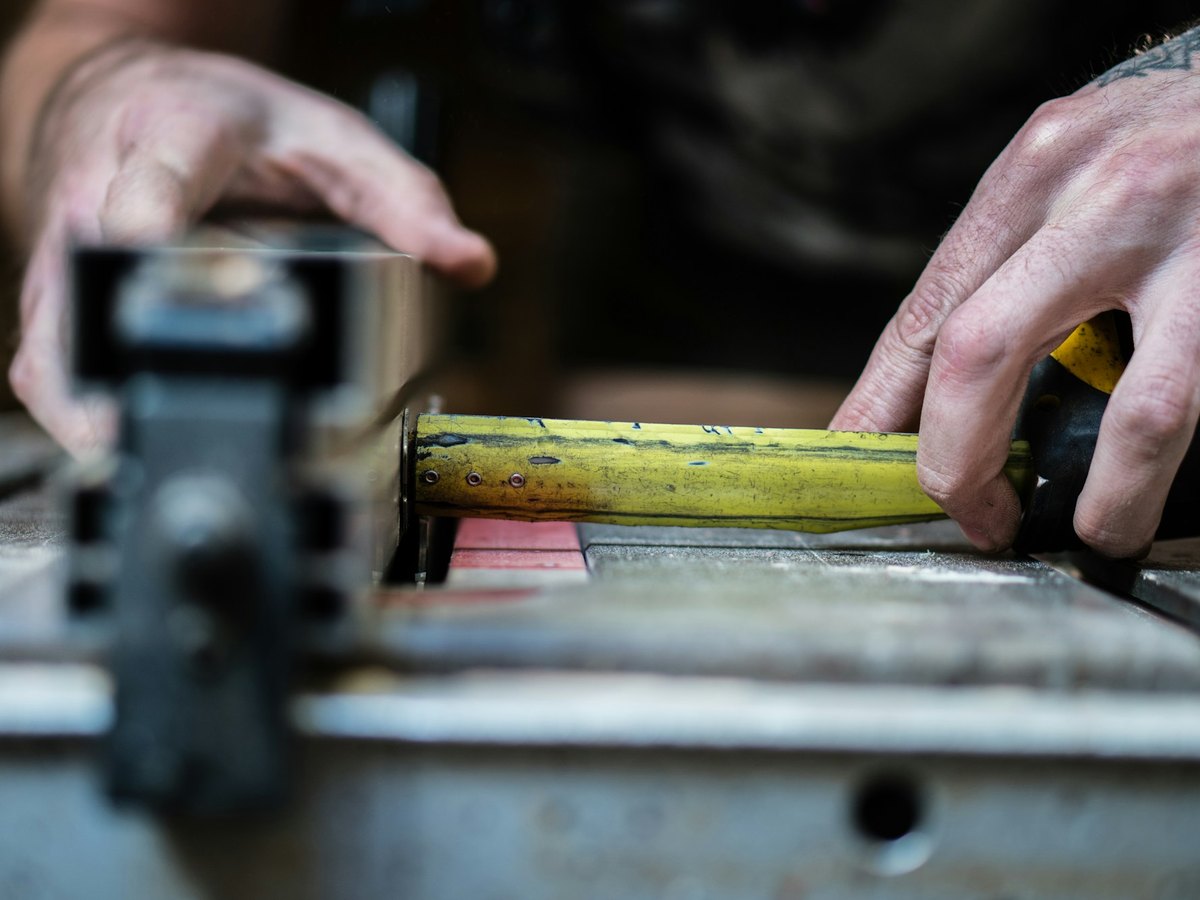Measuring equipment on site with a tape measure
