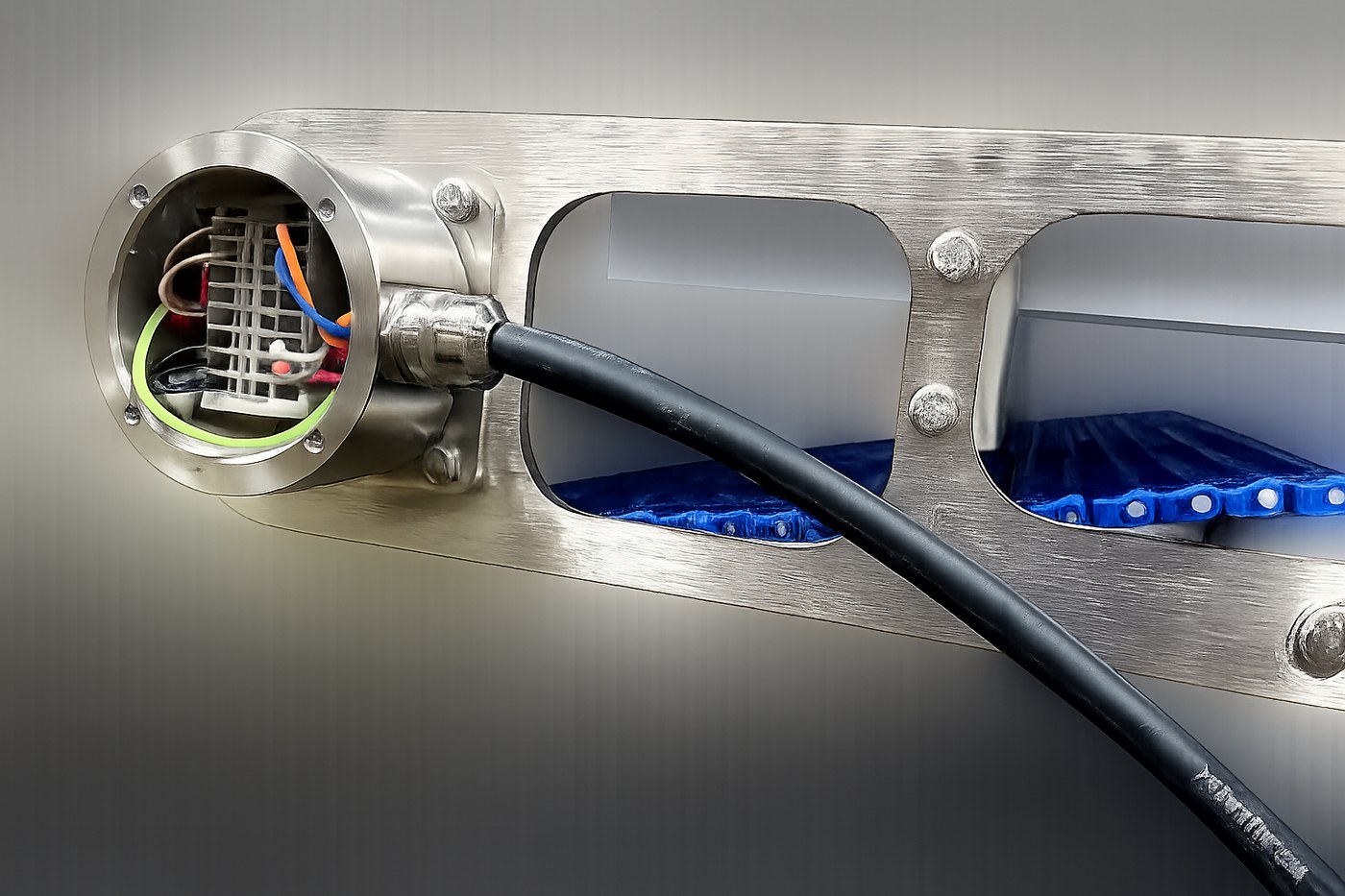 Wired motor junction box on a stainless conveyor frame